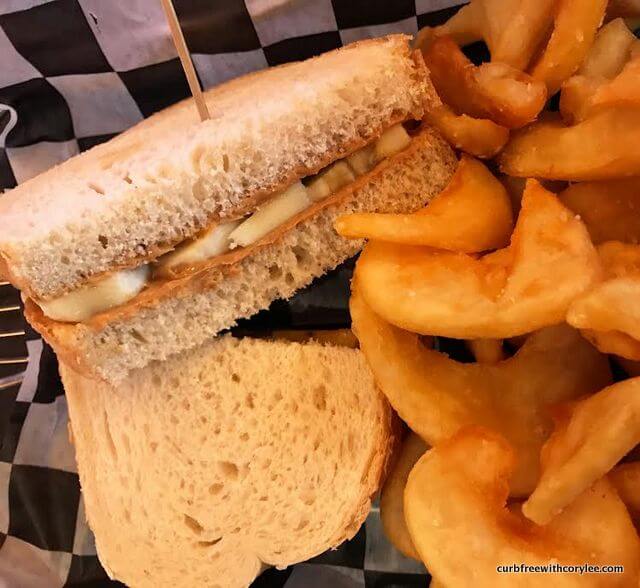 Peanut butter and banana sandwich with fries