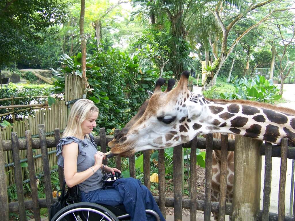 Kelly with a giraffe in Singapore